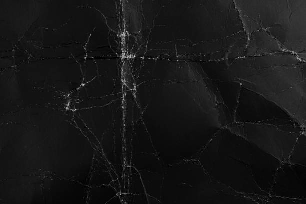 Abstract rough black background. Old packing grungy dark cardboard material Abstract rough black background. Old packing grungy dark cardboard material. For web page design. black folded paper texture stock pictures, royalty-free photos & images