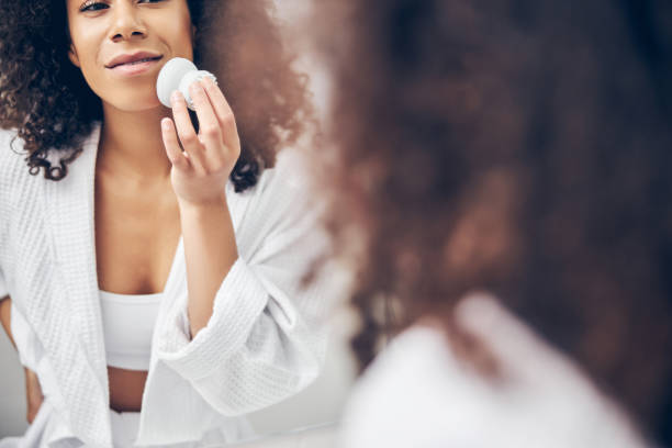 istock Contented relaxed woman doing a cosmetic procedure 1256771803
