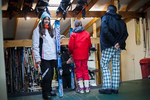 People choosing ski equipment for rent to have ski class in Ushuaia Patagonia Argentina