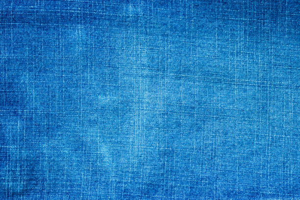 istock Denim blue jeans texture close up background top view 1256777038