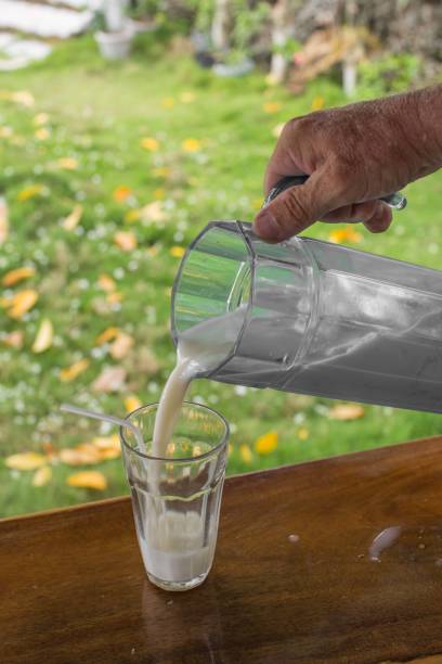 istock pour fresh coconut juice into a glass 1256779978
