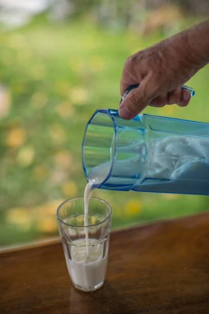 istock pour fresh coconut juice into a glass 1256779979