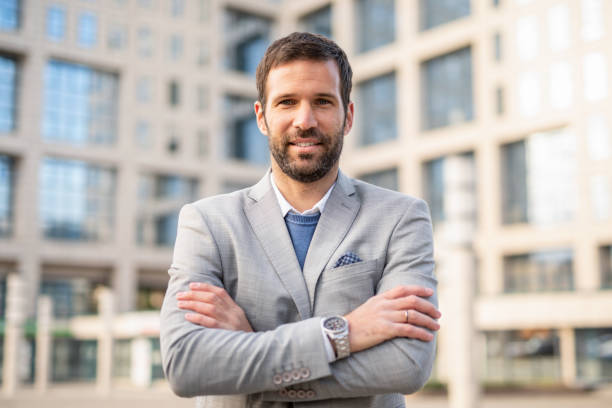 istock Mid adult businessman looking at camera. 1256783656