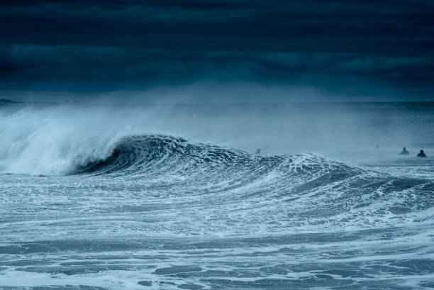 istock Surfing Under Dark Skies 1256783707