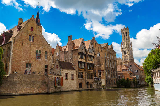 istock Canal in Bruges and Belfry tower 1256787465