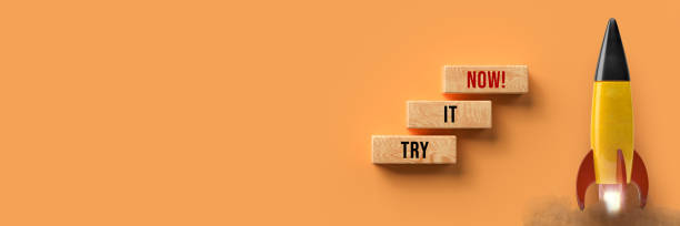 istock starting colorful rocket and cubes with message TRY IT NOW - 3d illustration 1256788299