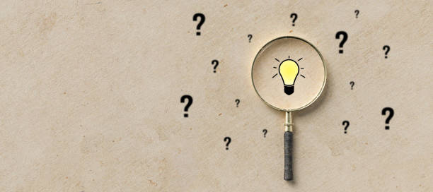 istock magnifying glass with lightbulb as symbol for finding a solution - 3d illustration 1256788361