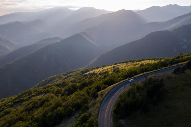 Car travelling in the mountains roads.