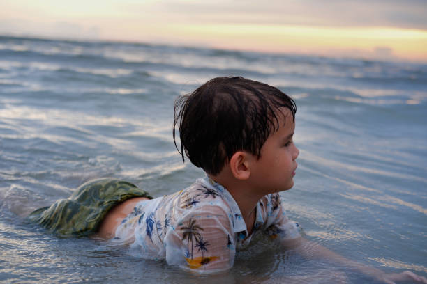 istock Happy boy in sea 1256795890