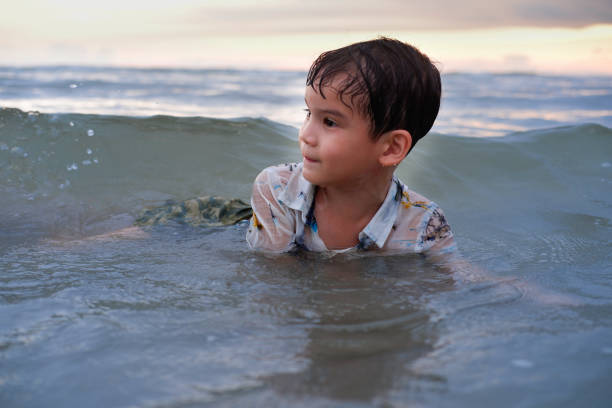 istock Happy boy in sea 1256796046