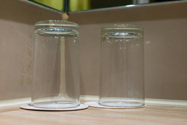 Couple of empty drinking glass on wooden table.selective focus shot