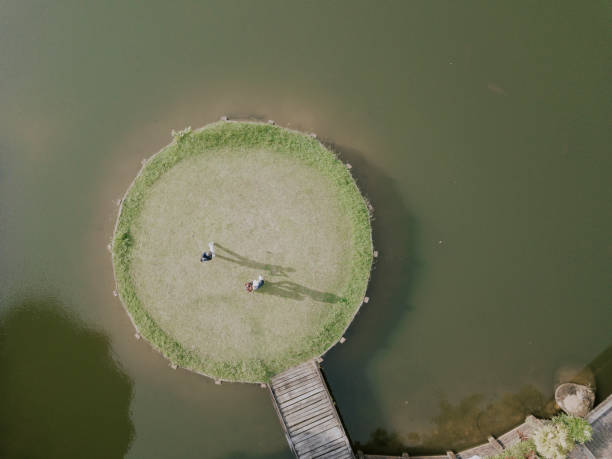 istock drone point of view golfer playing golf in golf course in melaka, malaysia 1256800402
