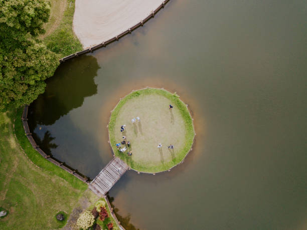 istock drone point of view golfer playing golf in golf course in melaka, malaysia 1256800418