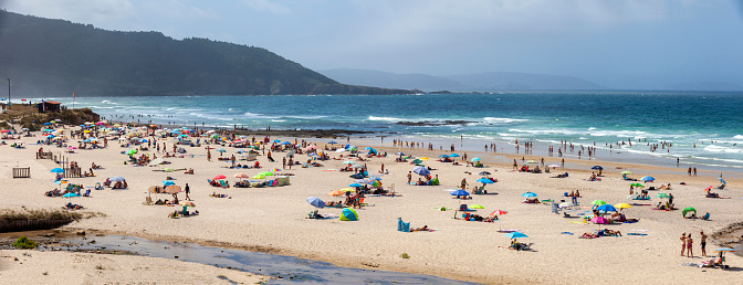 Bathers and tourists on the Razo beach in Carballo, Costa de la Muerte, Galicia, Spain
