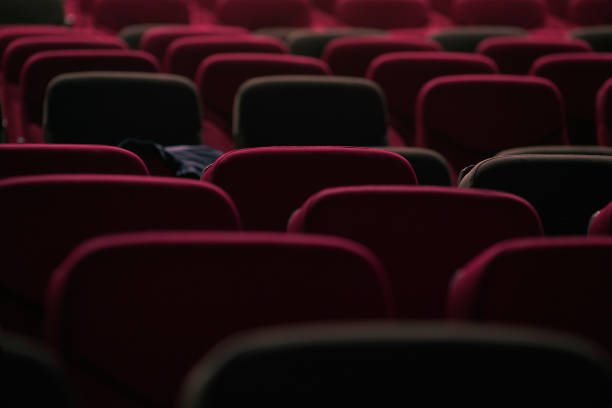 istock abstract red cinema seats in dark tone for background 1256801900
