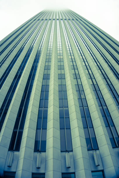 istock Skyscaper building with vertical leading architectural lines towering skyward 1256802641