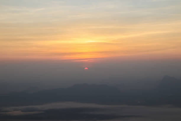istock Beautiful sunset or sunrise sky above clouds with dramatic light. 1256804478