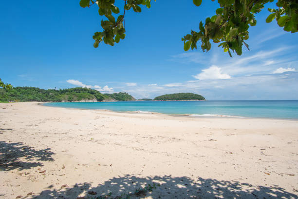 istock Beach sea sand and sky in summer day 1256806864