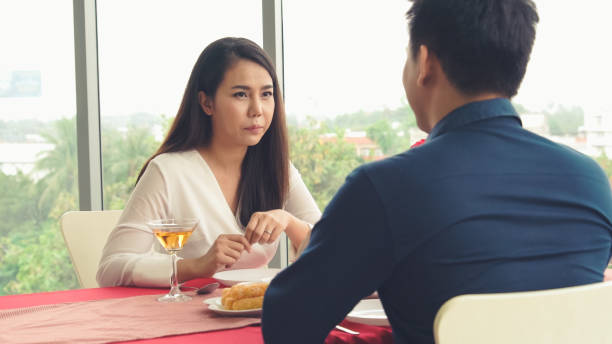 istock Happy romantic couple eating lunch at restaurant 1256815606