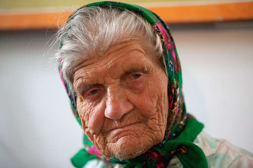The face is very old grandmother. Woman in a hundred years