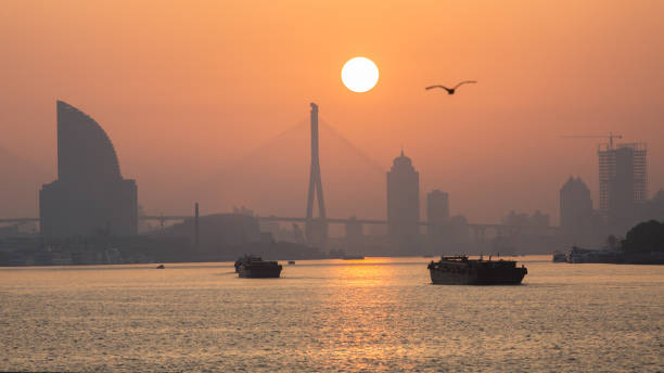 istock Sun rising above Huangpu River 1256816970