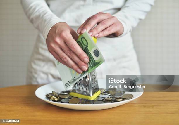 Exchange Euros For Cents Using A Grater Concept On The Theme Of Money Stock Photo - Download Image Now