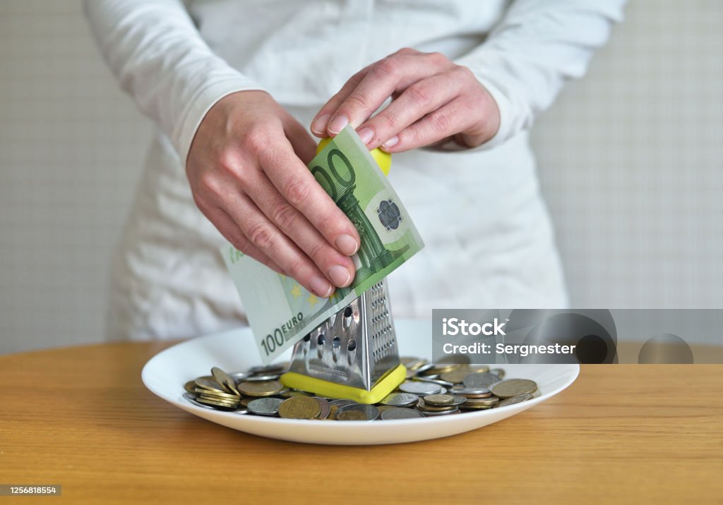 exchange euros for cents using a grater. concept on the theme of money Banking Stock Photo