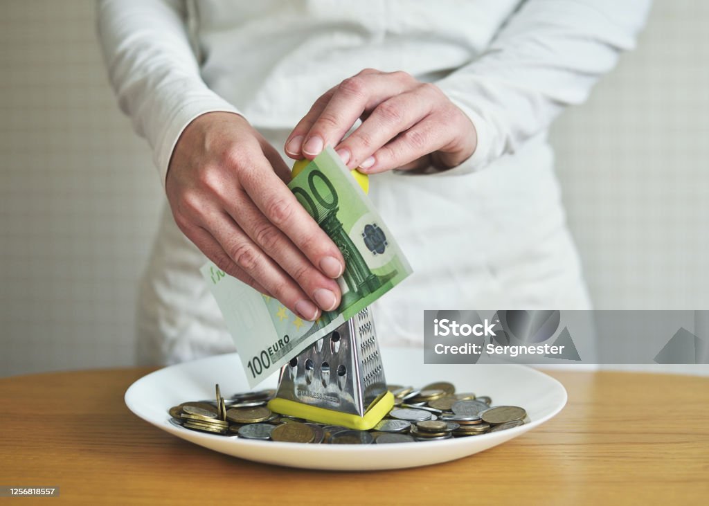 exchange euros for cents using a grater. concept on the theme of money Banking Stock Photo