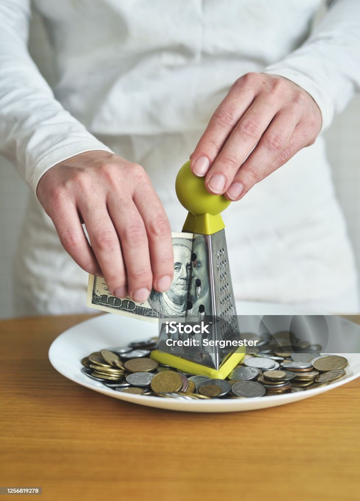 exchange dollars for cents using a grater. concept on the theme of money Budget Stock Photo