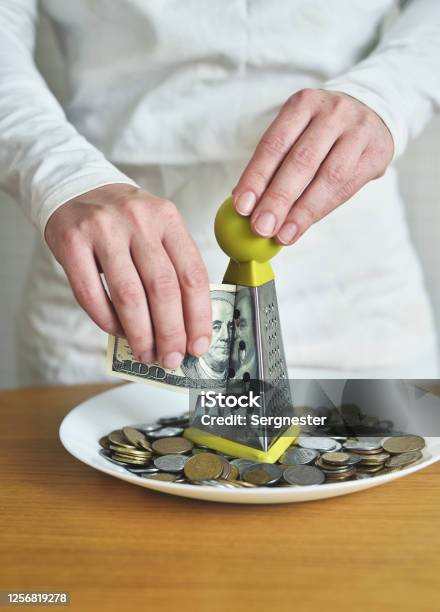 Exchange Dollars For Cents Using A Grater Concept On The Theme Of Money Stock Photo - Download Image Now