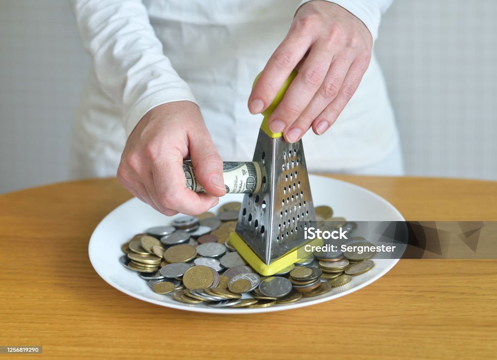 exchange dollars for cents using a grater. concept on the theme of money Banking Stock Photo