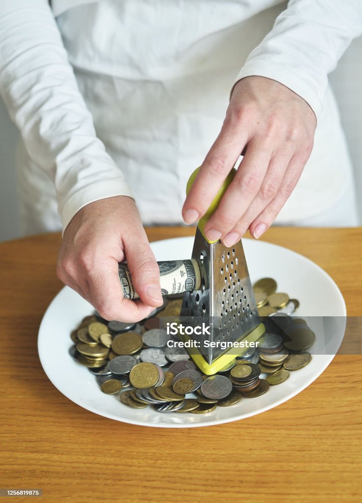 exchange dollars for cents using a grater. concept on the theme of money Banking Stock Photo