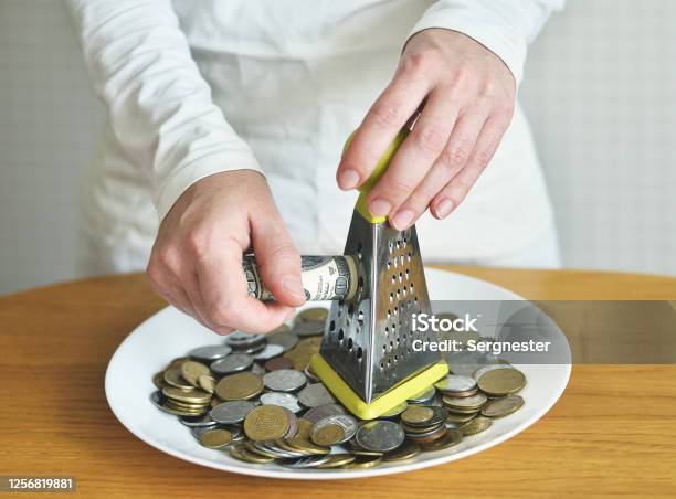 Exchange Dollars For Cents Using A Grater Concept On The Theme Of Money Stock Photo - Download Image Now