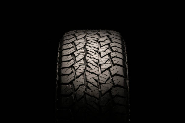 istock at 2 tires front view, on a black background 1256822068
