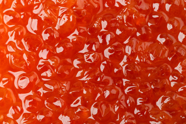 istock salmon caviar close-up, place for text. a useful delicacy. 1256824312