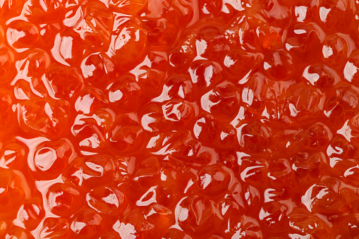 salmon caviar close-up, place for text. a useful delicacy. Caviar grains are clearly visible