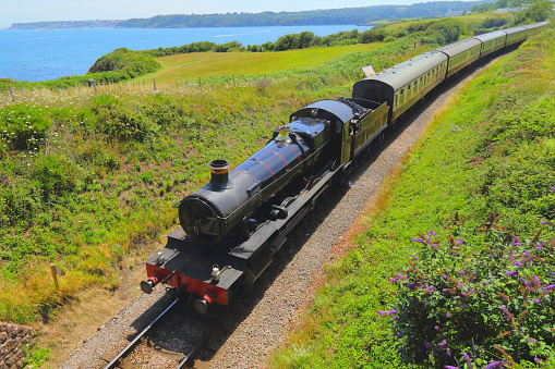 Train with vintage locomotive on the South Devon coast, UK