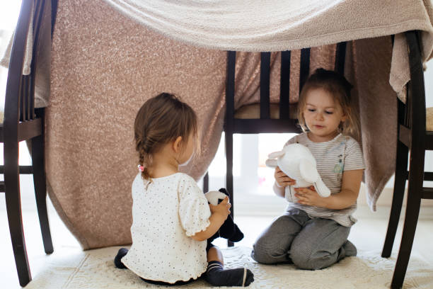 istock Funny lovely sisters 1256829430