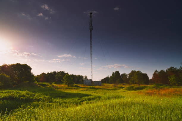 istock Internet 5G antenna at dawn in the field. 1256830699