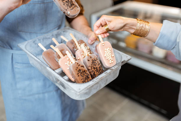 istock Seller with ice cream on a stick 1256837215