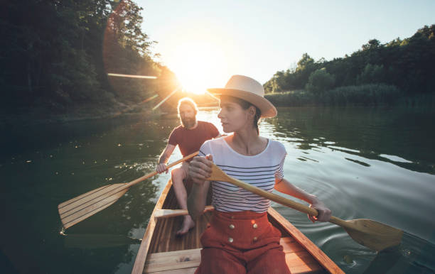 istock Couple enjoying summer canoe ride 1256839691