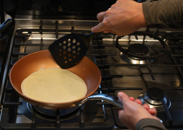 istock A close up of someone making pancakes 1256839702