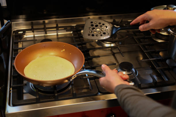 istock A close up of someone making pancakes 1256839717