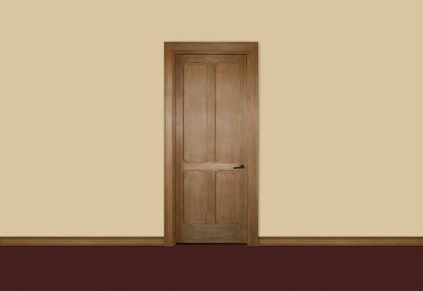 istock Single wooden door against a beige wall 1256841662