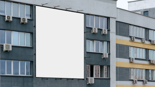 istock large white blank bigboard on wall of modern building with windows and air conditioners rental and sell housing concept 1256841763