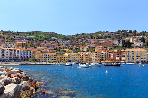 Panoramic view of small italian colorful town with boats