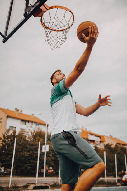 istock Young basketball player ready to shoot 1256848937
