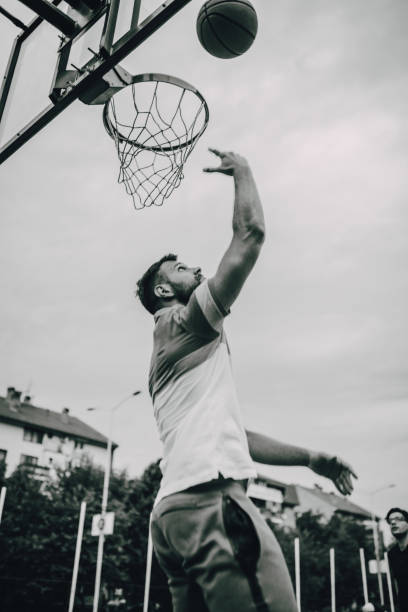 istock Young basketball player ready to shoot 1256849010