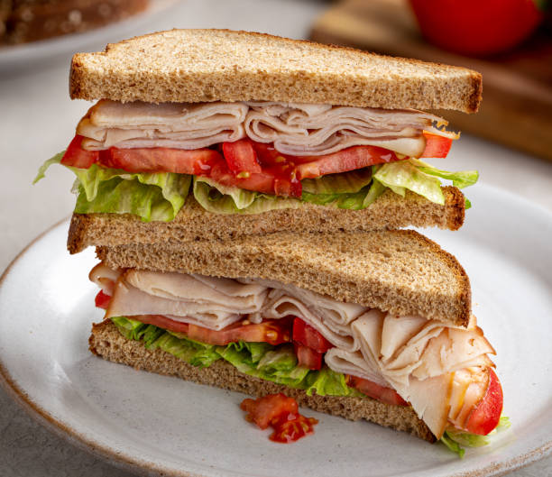 istock Turkey Sandwich on Whole Wheat Bread 1256850413