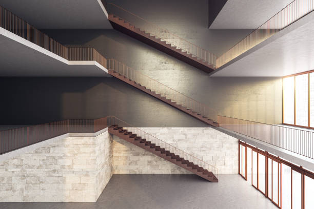 istock Modern staircase on concrete modern high-rise building interior. 1256850449
